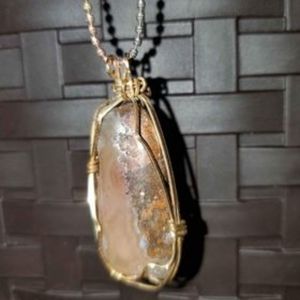 Natural brown quartz stone with gold wire wrapped charm with gold plated chain.